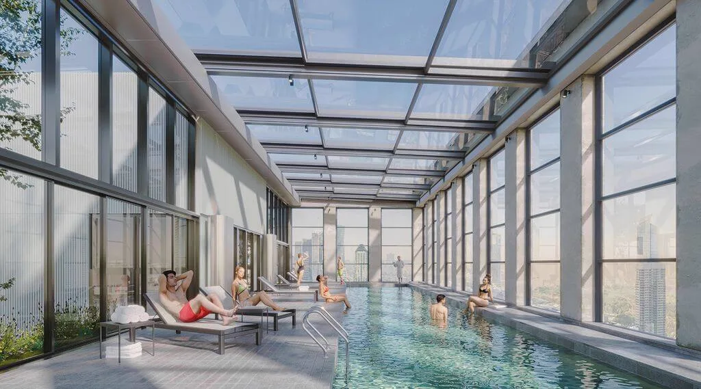 Piscina climatizada con solárium y cubierta vidriada retráctil.